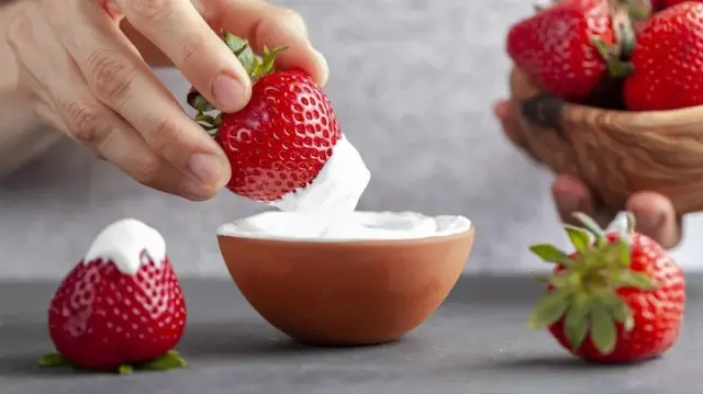 Coat Strawberries in a Deliciously Sweet and Zesty Mixture for a Delightful Snack.