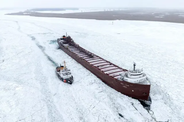 Icebreakers are actively engaged in efforts to liberate a freighter trapped in the St. Clair River close to Harsens Island.